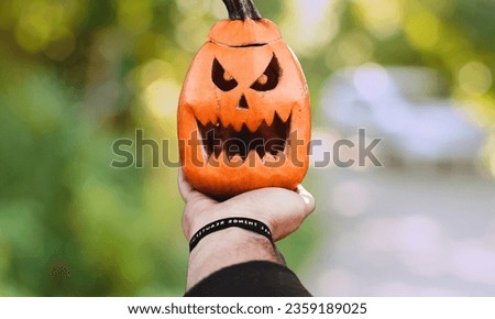 Halloween orange colour Pumpkin Head, glowing evil jack-o-lantern pumpkin With Hand,  I took a picture of Halloween, Clean Background, October 31, Halloween Backdrop