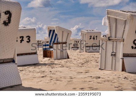 beach chairs with numbers on the beach of Sankt Peter Ording, Germany
