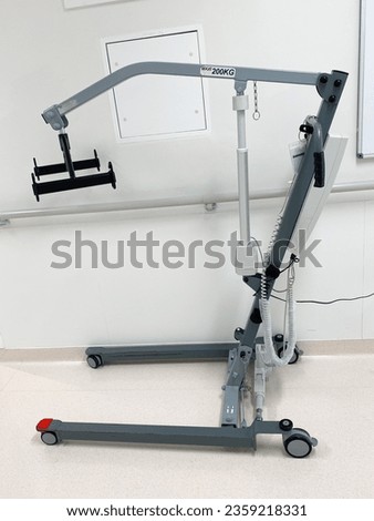 Electric Hoist used in hospitals, health care and care homes for transferring and moving bedridden patients. Royalty-Free Stock Photo #2359218331