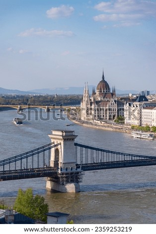 A picture of many Budapest landmarks over the Danube, such as the Hungarian Parliament Building, the Szechenyi Chain Bridge and the Margaret Bridge at the far left.
