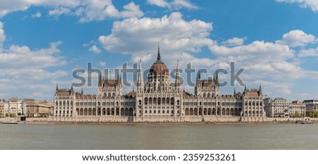 A picture of the iconic Hungarian Parliament Building as seen from the other side of the Danube river.
