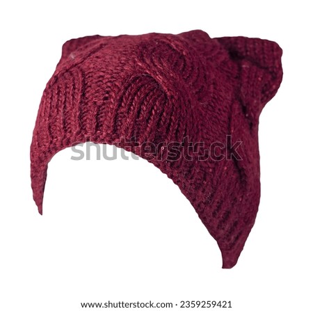 women's burgundy hat knitted isolated on white background. warm winter accessory Royalty-Free Stock Photo #2359259421