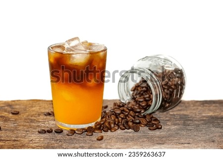 Americano ice coffee and coffee beans spread on old wooden with white background concept isolated picture.