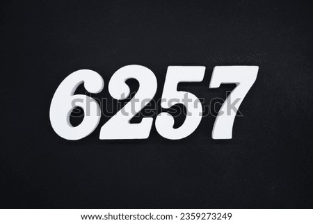 Black for the background. The number 6257 is made of white painted wood.