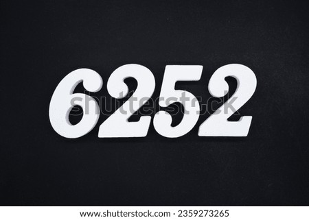 Black for the background. The number 6252 is made of white painted wood.