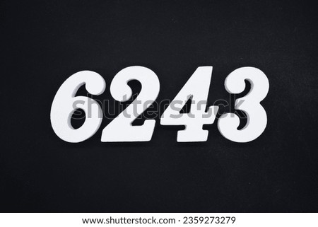 Black for the background. The number 6243 is made of white painted wood.