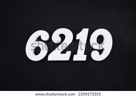 Black for the background. The number 6219 is made of white painted wood.