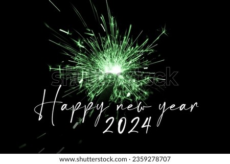Happy new year 2024 green sparkler new years eve countdown. Luxury entertainment celebration turn of the year party time. Premium nightlife visual with glowing light sparks on dark background