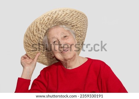 Portrait of happy senior woman laughing isolated on white studio background. Human emotions concept. emotional old lady with hat