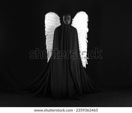 demon angel with white wings on a black background