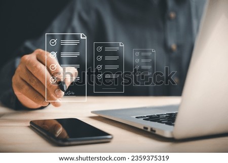 Manager signs business contract online with electronic signature app on screen. Closeup shot captures efficiency of e-signing and digital document management. Paperless office concept is highlighted. Royalty-Free Stock Photo #2359375319