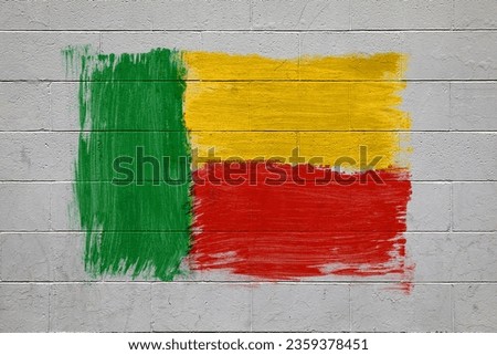 Benin flag colors painted on brick wall