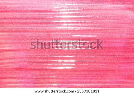 Pink shimmering lip gloss texture background with highlights. Smudged cosmetic product smear. Makup swatch product sample Royalty-Free Stock Photo #2359381811