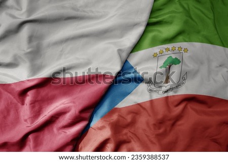 big waving national colorful flag of poland and national flag of equatorial guinea . macro