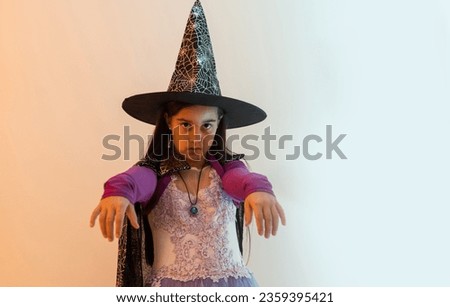 teenage girl in a witch costume, happy halloween holiday.