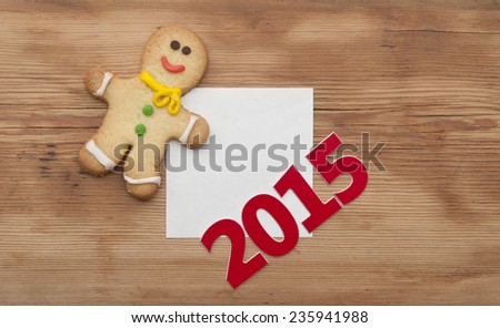 Christmas 2015 cookie with homemade christmas painted ginger breads (gingerbread man) on the wooden background 