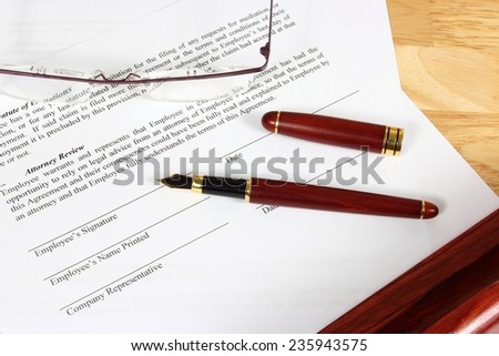 Business objects - full time employment contract ready to sign with ink pen.