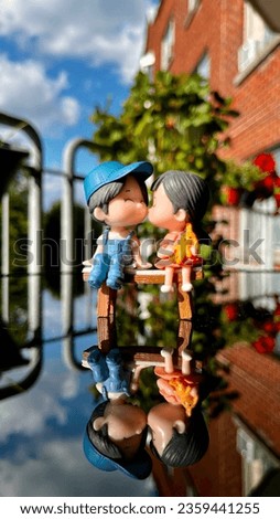 Cute little toys of a boy and girl kissing on a bench ♥️ Love is in the air and they are on Cloud!!