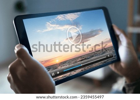 Cropped Image Of Man Watching Movie On Digital Tablet At Home