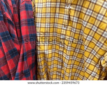 Checkered red and yellow squares wardrobe cloth soft textured fabric photography. Fashion clothing images.