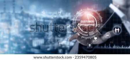 Customer engagement, enhancing brand loyalty, customer relationship management (CRM) concept. Businessman touching on screen with wording "CUSTOMER ENGAGEMENT" on digital background and copy space.