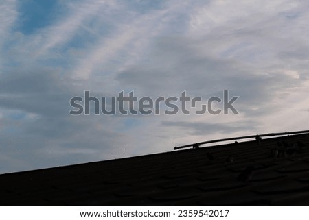 beautiful view of the evening sky. blue sky with white clouds. shadows of buildings under the evening sky