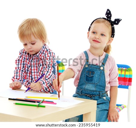 Girl and boy sitting at the table draw.Childhood education development in the Montessori school concept. Isolated on white background.