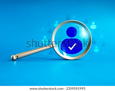 Human resource, hiring, selection, recruitment, CRM, right people and unique concepts. Business person icon with checkmark, the chosen one person from the crowd in magnifying lens on blue background.