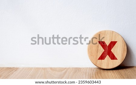 Circle wooden block with red wrong mark. Illustrate the wrong login decision concept. Vote and think wrong. Choose a business for difficult situations, true and false symbols. Choose the wrong sign