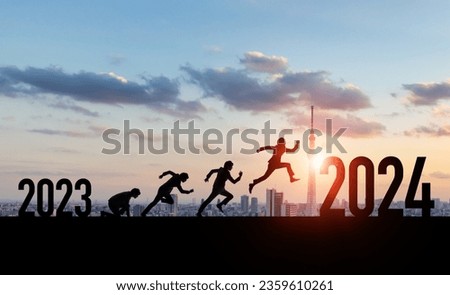 Silhouette of a man jumping from 2023 to 2024. 2024 New Year concept. New year's card 2024.