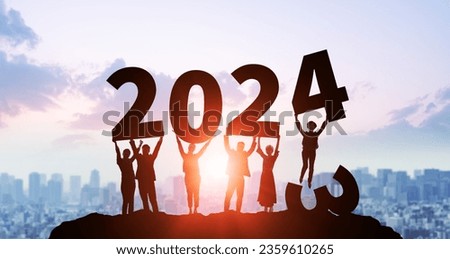 Multinational people holding up the year 2024. 2024 New Year concept. New year's card 2024.