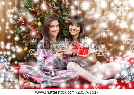 Beautiful young sisters twins. Christmas and New Year