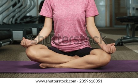 beautiful young healthy caucasian woman stretching and exercise yoga in gym. Fitness lifestyle indoor. Relaxation workout in sport club background. healthy and care concept.