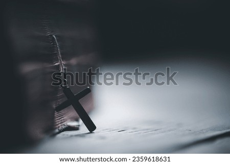 Spirituality, Religion and Hope Concept. Holy bible and cross on desk. Symbol of Humility, Supplication, Believe and Faith for Christian People.