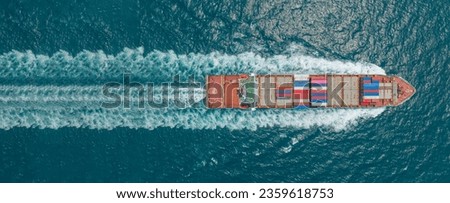 Aerial top view of cargo maritime ship with contrail in the ocean ship carrying container and running for export concept technology freight shipping by ship forwarder mast