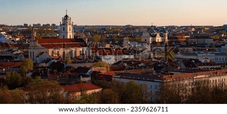 Panoramic view of Vilnius townscape against sky at sunset