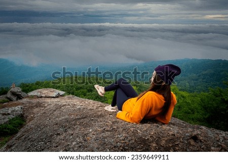 Lifestyle traveler women happy feeling good relax and freedom facing 
in the sunrise morning.Travel Concept