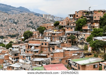Colorful streets of Comuna 13 district in Medellin, Colombia, a former crime ridden neighborhood. Royalty-Free Stock Photo #2359650421