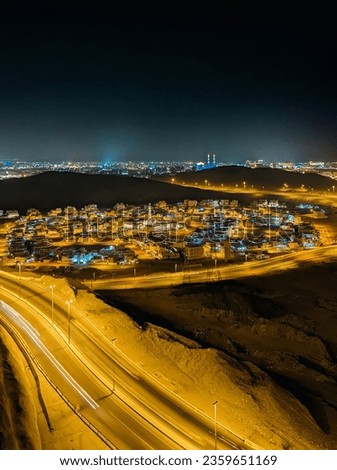 beautiful Muscat city in night light from top view 