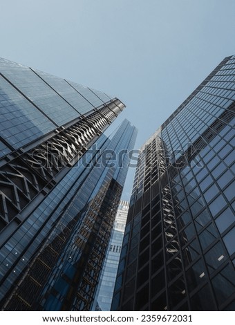 High resolution, simple background imagery of modern financial office block buildings in the city of London with clear blue skies with negative space Royalty-Free Stock Photo #2359672031