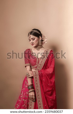 Beautiful Indian bridal in studio shot. 
Magnificent young Indian bride in luxurious bridal  Royalty-Free Stock Photo #2359680037