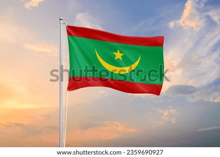 Mauritania flag waving on sundown sky