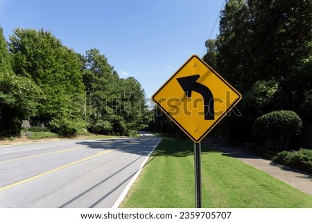 a traffic sign next to a quiet road