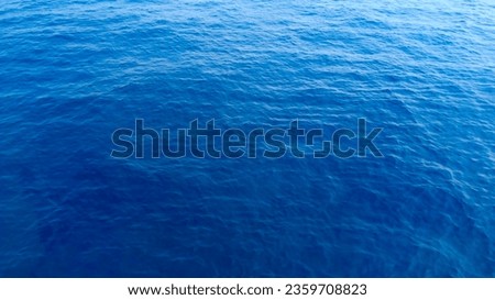 blue and turquoise clear sea water and surfing boat at island