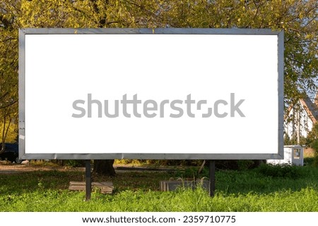 Blank white advertising billboard in the city