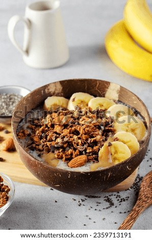 Chia Pudding Bowl with Banana, Granola and Cinnamon, Healthy Breakfast or Snack, Vegetarian Food Royalty-Free Stock Photo #2359713191