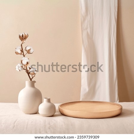 Beige ceramic vases with dry cotton branches. Stylish and minimalistic background for display your products in living room. Scandinavian interior. Modern home decor. Copy space. Royalty-Free Stock Photo #2359739309