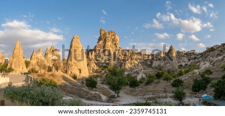 Uchisar Castle, town in Cappadocia, Turkey near Goreme. Panorama of Cappadocia landscape and valley with ancient rock formation and caves.
