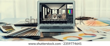 Interior designer workspace table and architecture software on laptop screen with mood board materials and colorful swatch color for color selection. Modern interior design office. Insight