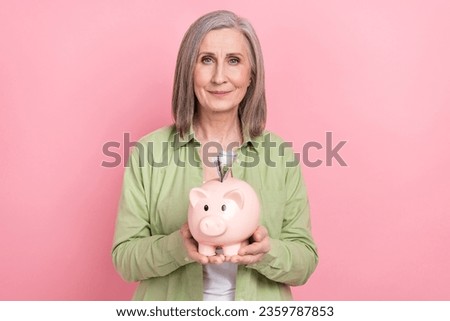 Photo of adorable successful rich lady wear trendy green clothes collect money financial independence isolated on pink color background